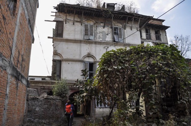 Approaching a building heavily damaged by the earthquake